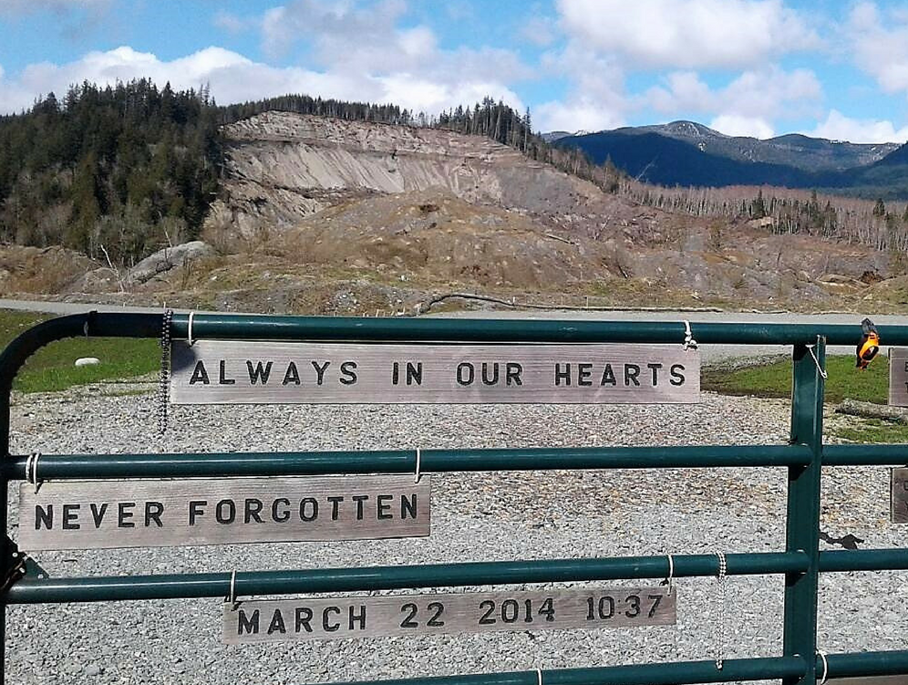 landslide site memorial with sign: Always in our hearts, never forget - March 22, 2017 10:37