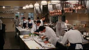 a lot of cooks working in kitchen
