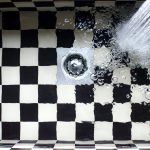 Checkered kitchen sink with water