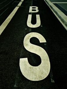 the word "bus" painted on the road